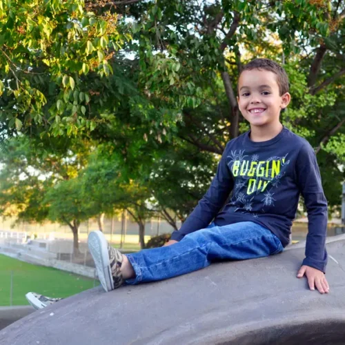 Kids showcasing their first day of school outfits in a lively setting