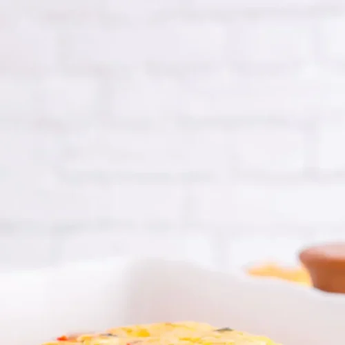 A healthy breakfast casserole arranged for meal prep in individual containers.