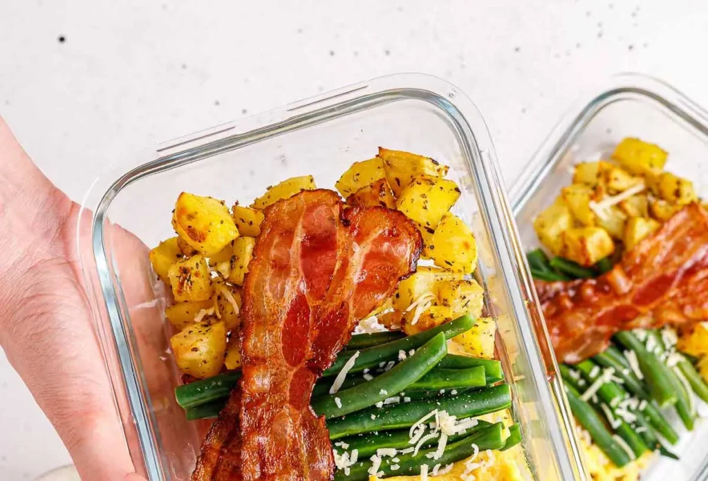 Various containers showcasing healthy breakfast meal prep ideas for the week.