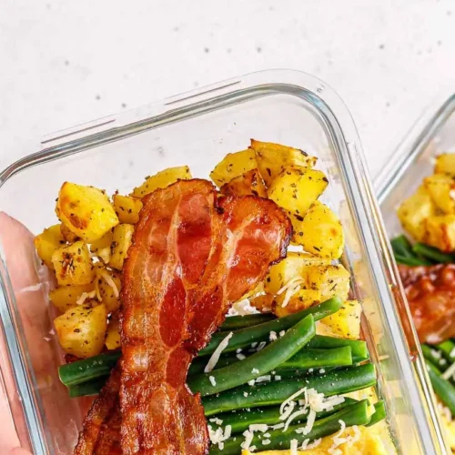 Various containers showcasing healthy breakfast meal prep ideas for the week.