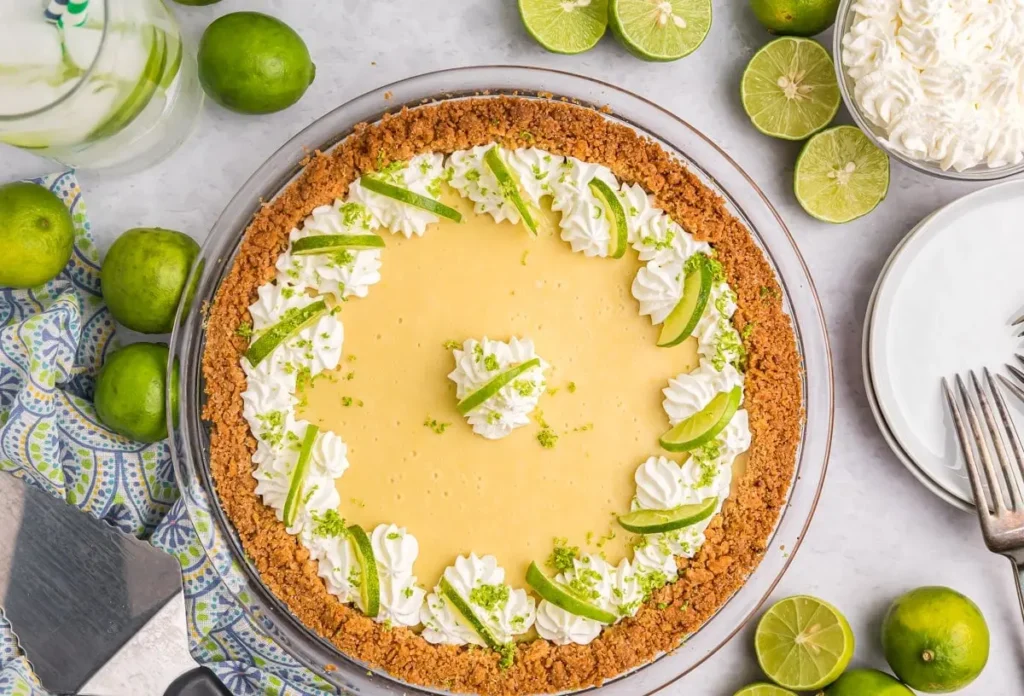 A vibrant green key lime pie with whipped cream topping