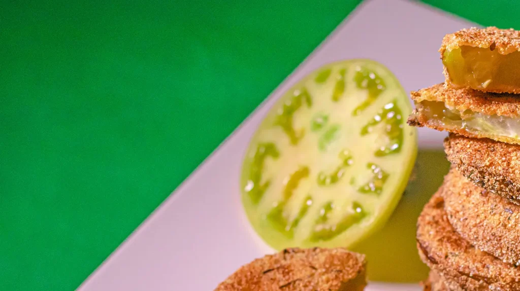 A close-up of perfectly crispy fried green tomatoes
